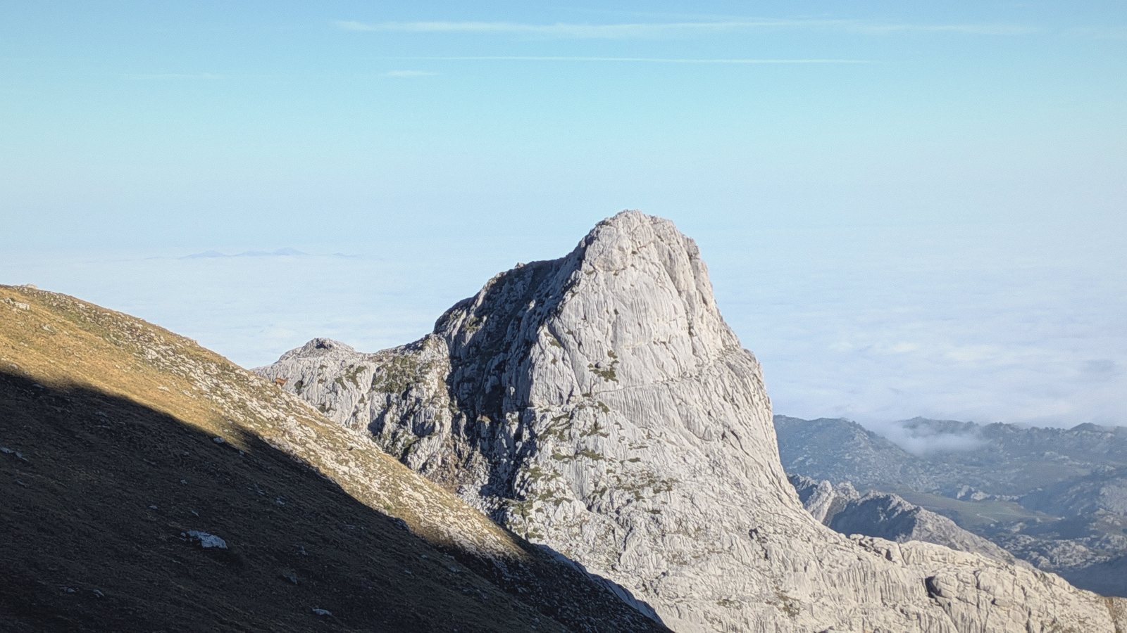 limestone peak above cloud
