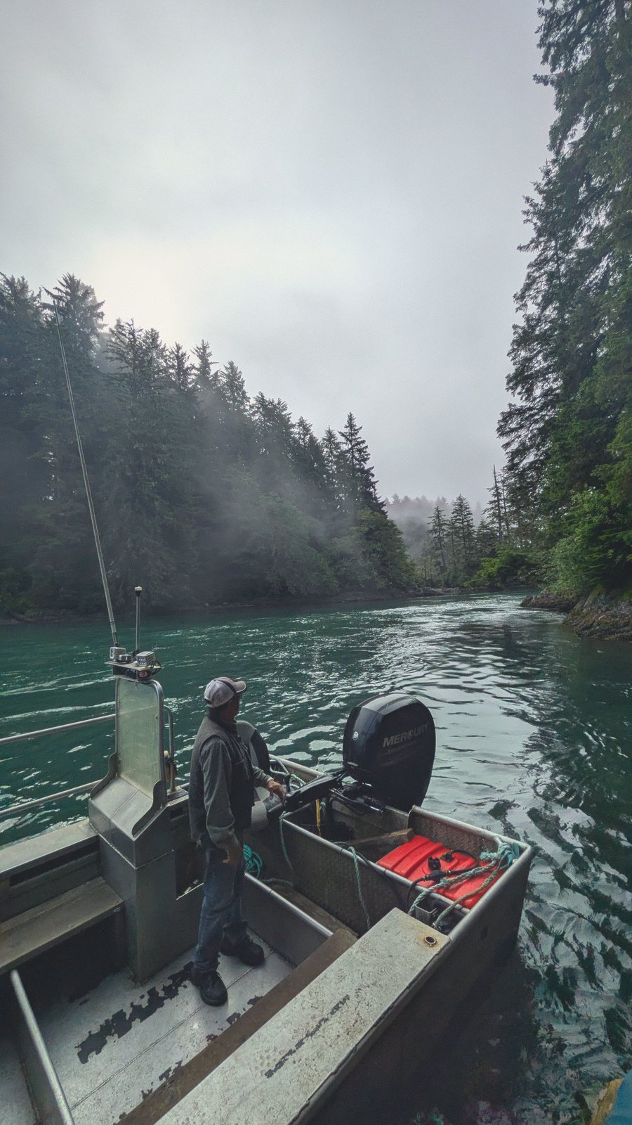 river skiff fisherman mist