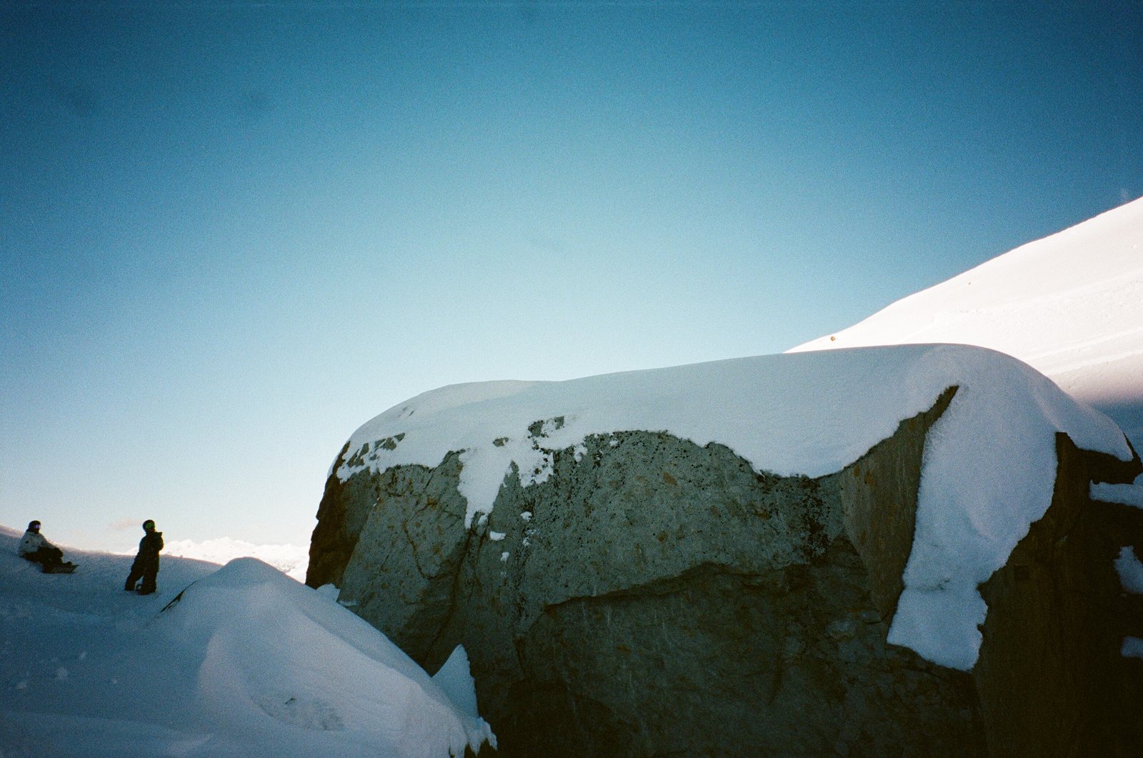 snow boulder two figures